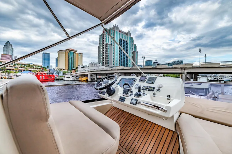  Yacht Photos Pics Flybridge view of 2013 Prestige 500 Fly yacht with city skyline backdrop.