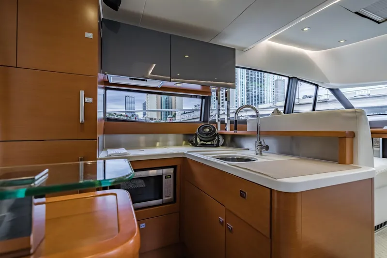  Yacht Photos Pics Luxurious kitchen interior of 2013 Prestige 500 Fly yacht with modern amenities.