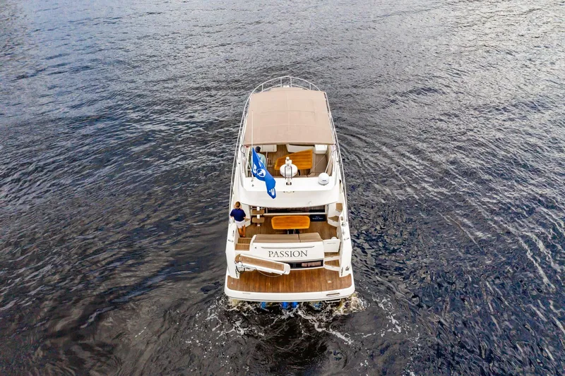  Yacht Photos Pics Aerial view of 2013 Prestige 500 Fly yacht cruising on open water.