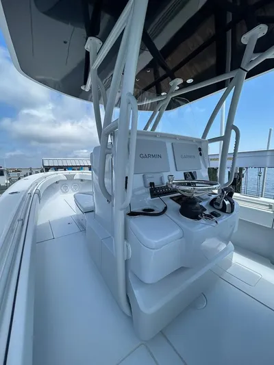  Yacht Photos Pics 2021 Contender 35 ST boat with Garmin electronics, sleek design, and spacious deck.