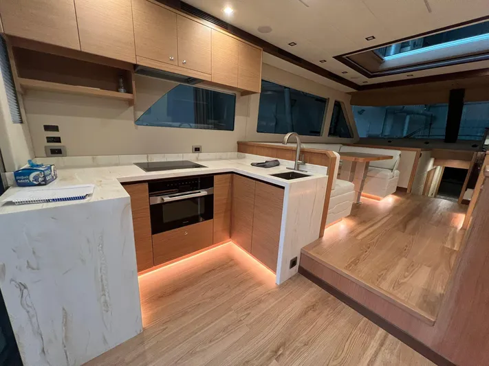 Sea At Last Yacht Photos Pics Luxurious 2025 Altima Express Coupe interior with modern kitchen and elegant wood finishes.