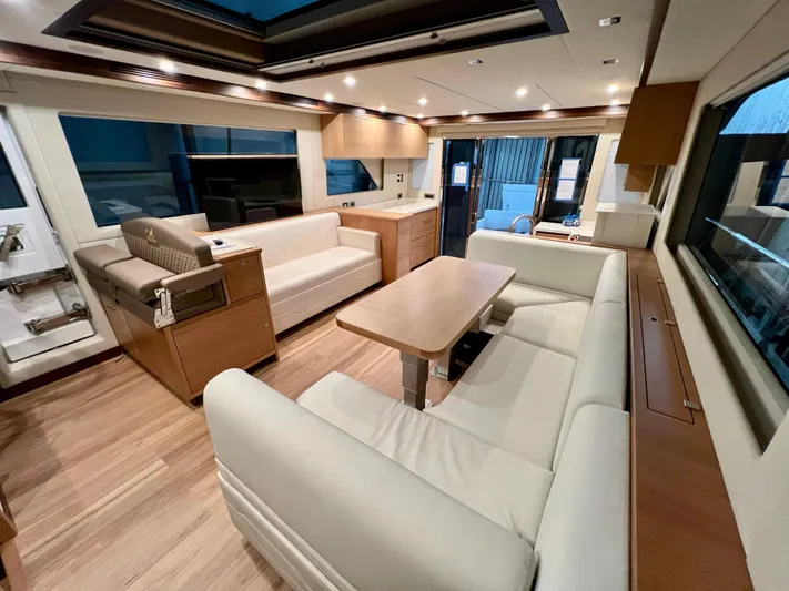 Sea At Last Yacht Photos Pics Luxurious interior of 2025 Altima Express Coupe with modern seating and wooden accents.