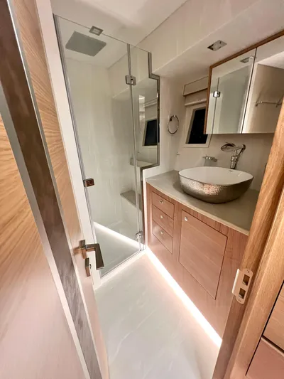 Sea At Last Yacht Photos Pics Luxurious bathroom in 2025 Altima Express Coupe with modern fixtures and elegant design.