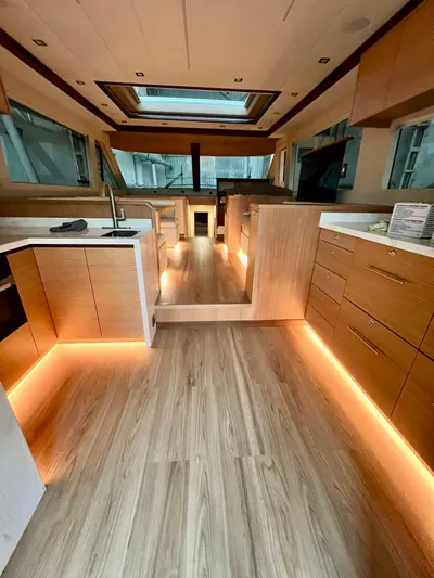 Sea At Last Yacht Photos Pics Luxurious interior of 2025 Altima Express Coupe with modern wood finishes and ambient lighting.