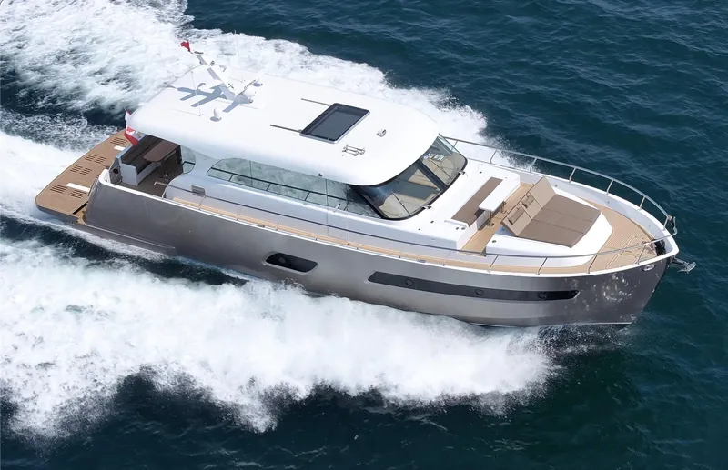 Sea At Last Yacht Photos Pics 2025 Altima Express Coupe yacht cruising on open water, showcasing sleek design and luxury features.