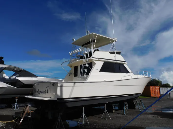 Miss Approach Yacht Photos Pics 1991 Viking 45' Convertible yacht on dry dock under a clear sky.