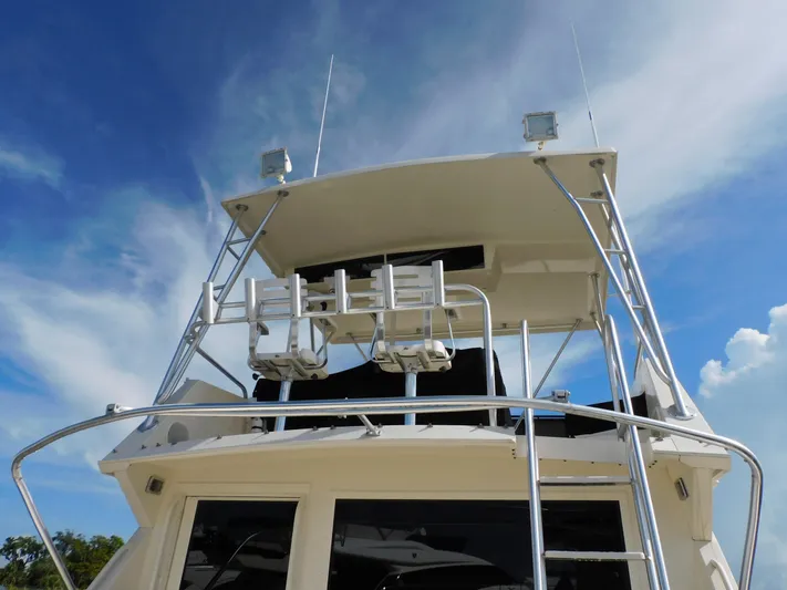 Miss Approach Yacht Photos Pics 1991 Viking 45' Convertible yacht, upper deck view against blue sky.