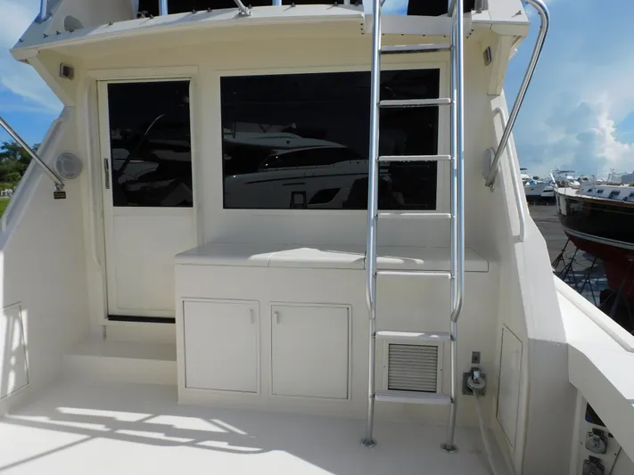 Miss Approach Yacht Photos Pics 1991 Viking 45' Convertible yacht exterior with ladder and storage compartments.