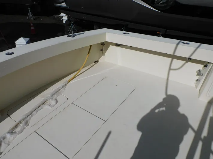 Miss Approach Yacht Photos Pics 1991 Viking 45' Convertible boat deck with storage compartments and hose.