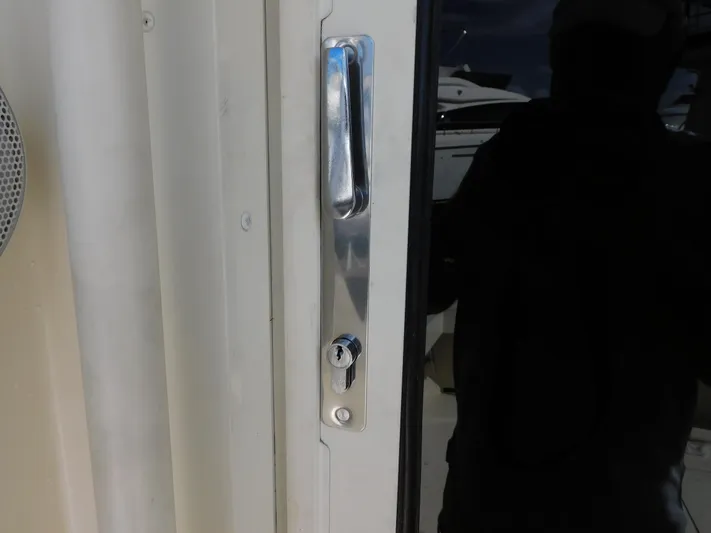 Miss Approach Yacht Photos Pics Close-up of a door handle on a 1991 Viking 45' Convertible yacht.