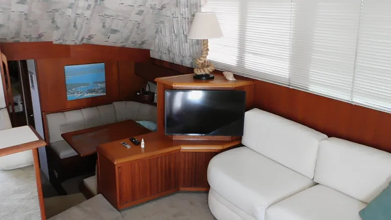 Miss Approach Yacht Photos Pics Interior of 1991 Viking 45' Convertible yacht with cozy seating and TV.
