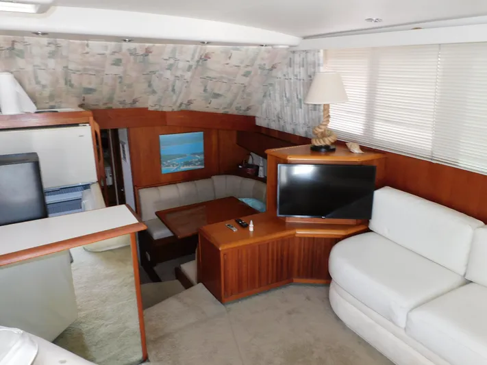 Miss Approach Yacht Photos Pics Interior of 1991 Viking 45' Convertible yacht with modern furnishings and cozy seating area.