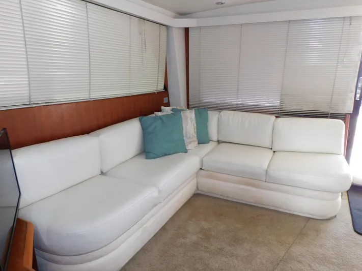 Miss Approach Yacht Photos Pics Luxurious white leather sofa in 1991 Viking 45' Convertible yacht interior.