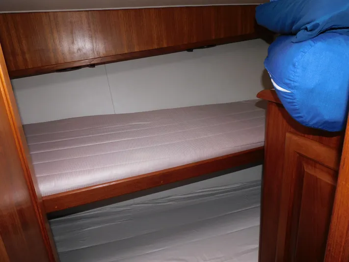 Miss Approach Yacht Photos Pics Interior of 1991 Viking 45' Convertible yacht with wooden bunk beds.