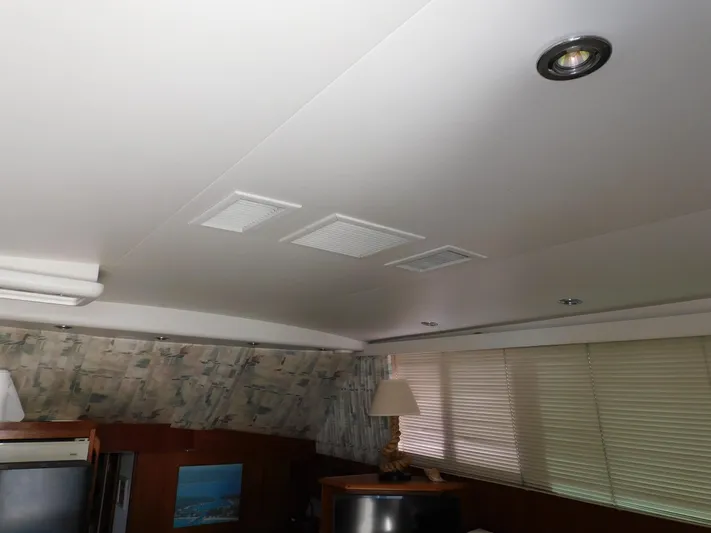 Miss Approach Yacht Photos Pics Interior of 1991 Viking 45' Convertible yacht with modern ceiling and blinds.