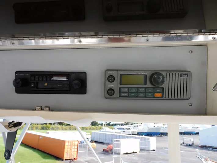 Miss Approach Yacht Photos Pics 1991 Viking 45' Convertible boat dashboard with radio and communication equipment.