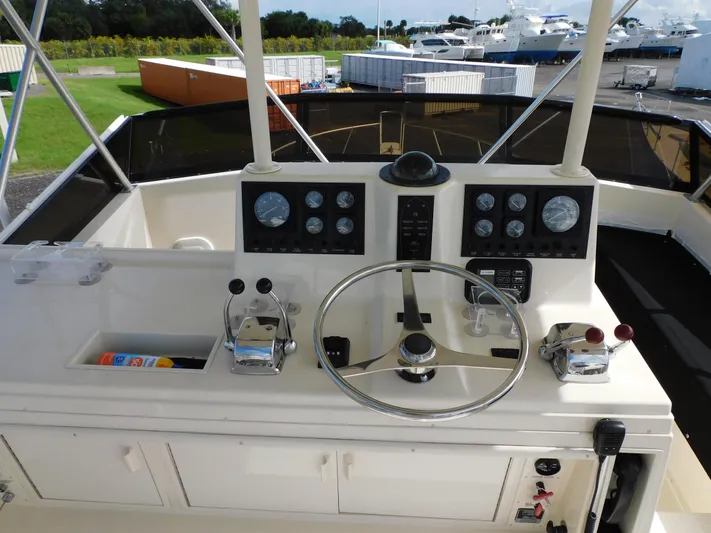 Miss Approach Yacht Photos Pics 1991 Viking 45' Convertible yacht helm with steering wheel and control panels.