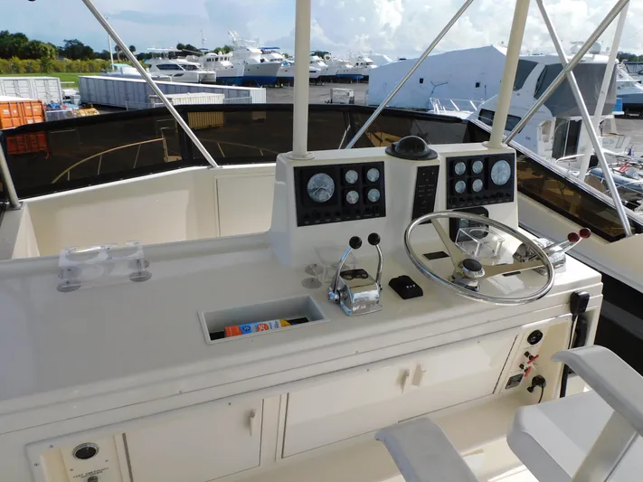 Miss Approach Yacht Photos Pics 1991 Viking 45' Convertible yacht helm with steering wheel and control panels.