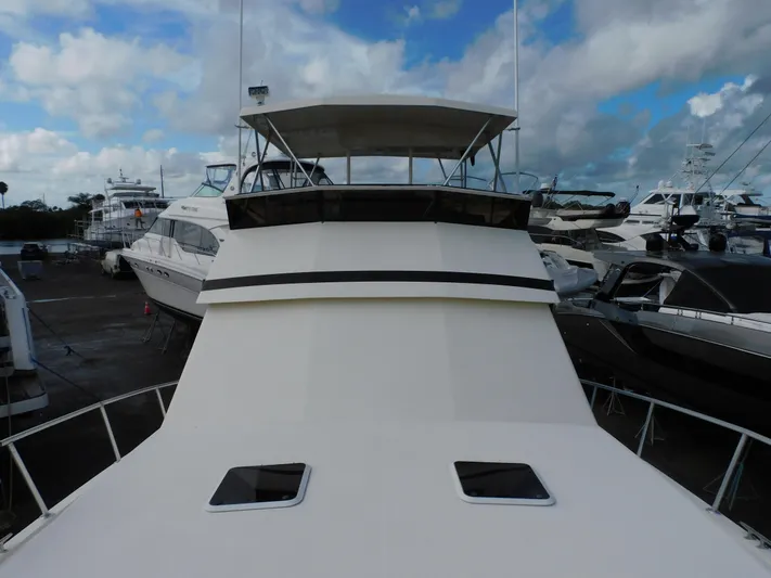 Miss Approach Yacht Photos Pics 1991 Viking 45' Convertible yacht docked, showcasing sleek design and spacious deck.