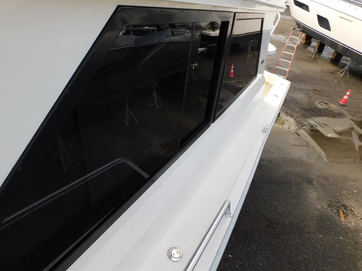 Miss Approach Yacht Photos Pics 1991 Viking 45' Convertible yacht side view with sleek windows and white exterior.