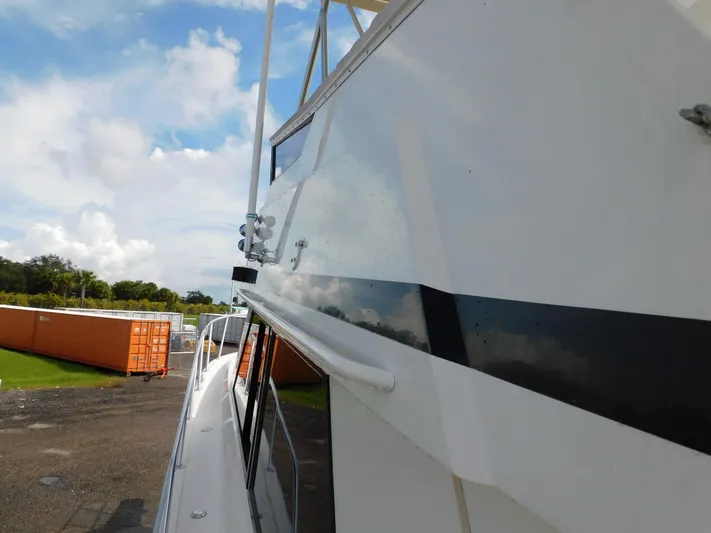 Miss Approach Yacht Photos Pics 1991 Viking 45' Convertible yacht side view with clear sky background.