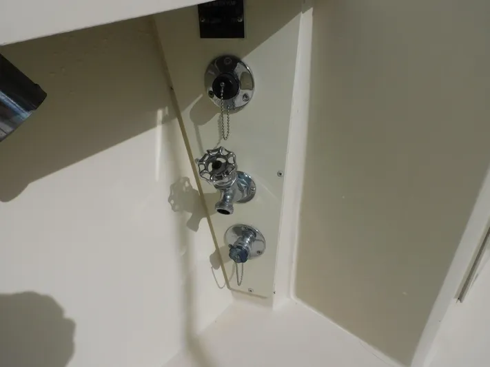 Miss Approach Yacht Photos Pics 1991 Viking 45' Convertible boat control panel with chrome fixtures.