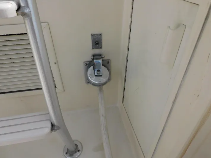 Miss Approach Yacht Photos Pics 1991 Viking 45' Convertible boat interior with mounted cable connection.