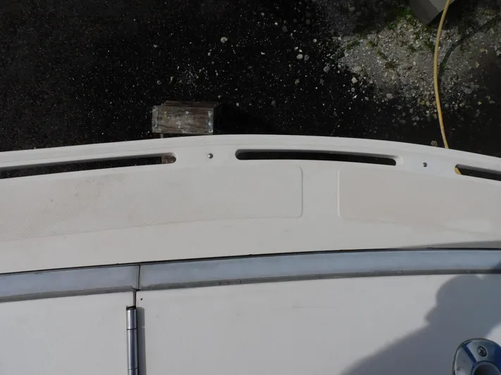 Miss Approach Yacht Photos Pics 1991 Viking 45' Convertible boat deck with textured surface and dock view.