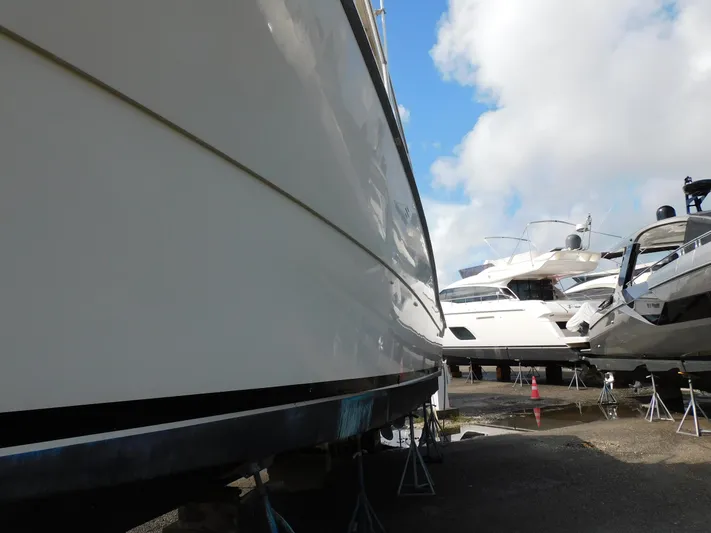 Miss Approach Yacht Photos Pics 1991 Viking 45' Convertible yacht on dry dock with other boats.