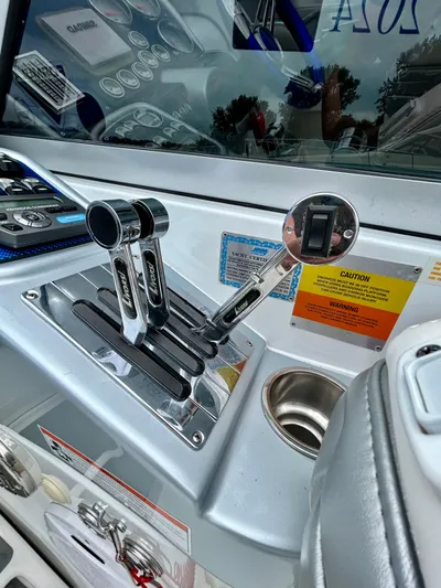  Yacht Photos Pics Control panel of a 2008 Formula 353 FASTech boat with throttle levers and warning labels.