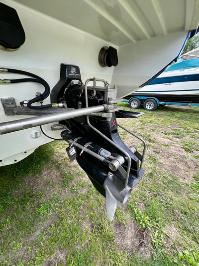  Yacht Photos Pics 2008 Formula 353 FASTech boat outdrive and propeller on grassy surface.