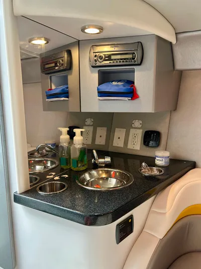  Yacht Photos Pics Interior of 2008 Formula 353 FASTech boat with sink, stereo, and storage compartments.