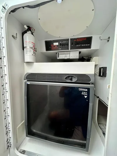  Yacht Photos Pics 2008 Formula 353 FASTech interior with refrigerator and fire extinguisher.