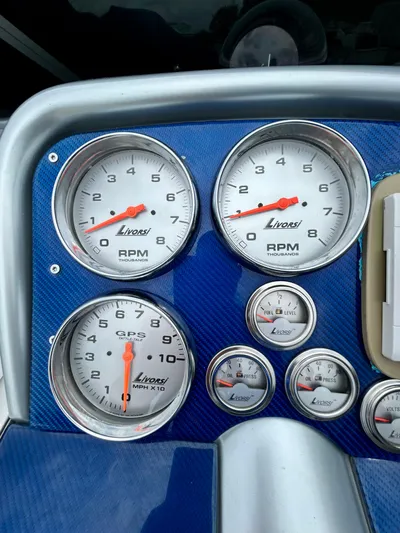  Yacht Photos Pics Dashboard of a 2008 Formula 353 FASTech with Livorsi gauges and blue carbon fiber panel.