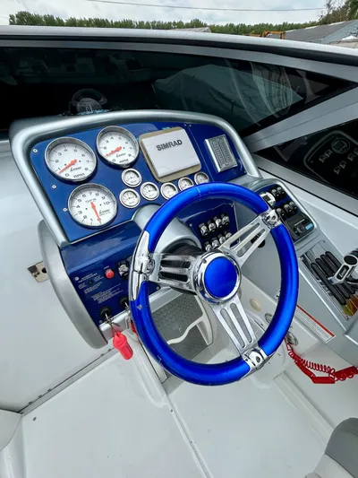  Yacht Photos Pics 2008 Formula 353 FASTech boat dashboard with blue steering wheel and gauges.