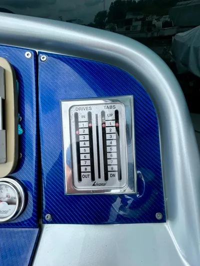  Yacht Photos Pics Control panel of a 2008 Formula 353 FASTech boat with blue carbon fiber finish.