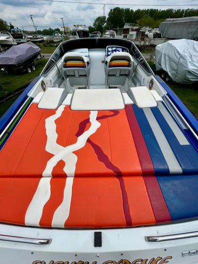  Yacht Photos Pics 2008 Formula 353 FASTech boat with colorful deck design, docked outdoors.