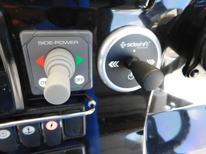  Yacht Photos Pics Control panel of a 2021 Jeanneau NC 1095 boat with Side-Power and Sideshift controls.