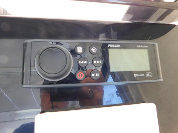  Yacht Photos Pics Fusion MS-RA70N marine stereo on Jeanneau NC 1095, 2021 model, with Bluetooth connectivity.