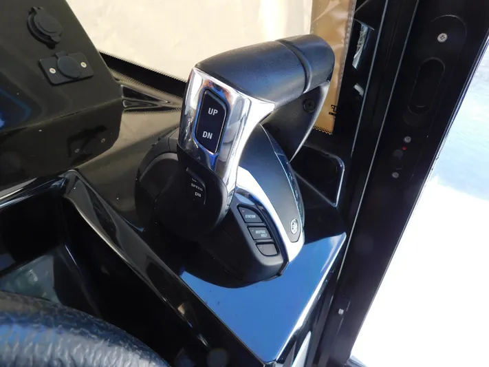  Yacht Photos Pics Throttle control of 2021 Jeanneau NC 1095 boat, featuring sleek design and modern controls.