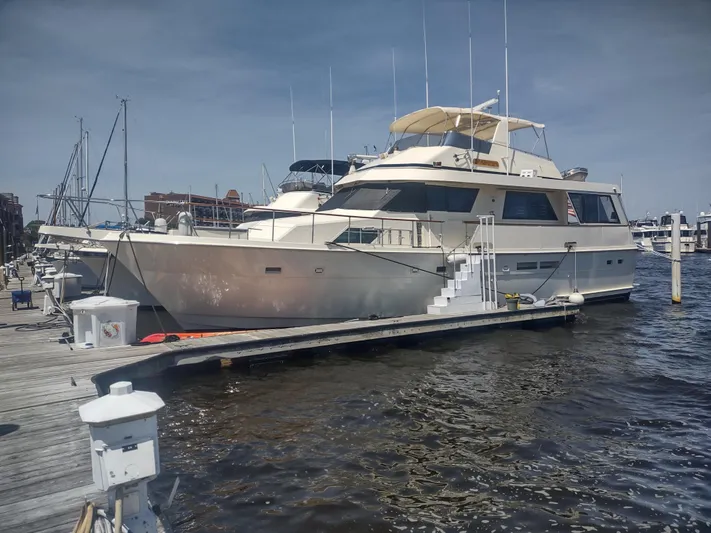  Yacht Photos Pics 1988 Hatteras 60 Motor Yacht docked at marina under clear sky.