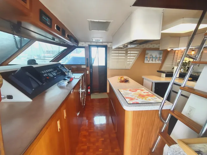  Yacht Photos Pics Interior of 1988 Hatteras 60 Motor Yacht with modern kitchen and control panel.