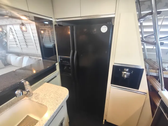  Yacht Photos Pics Interior of 1988 Hatteras 60 Motor Yacht kitchen with modern appliances.