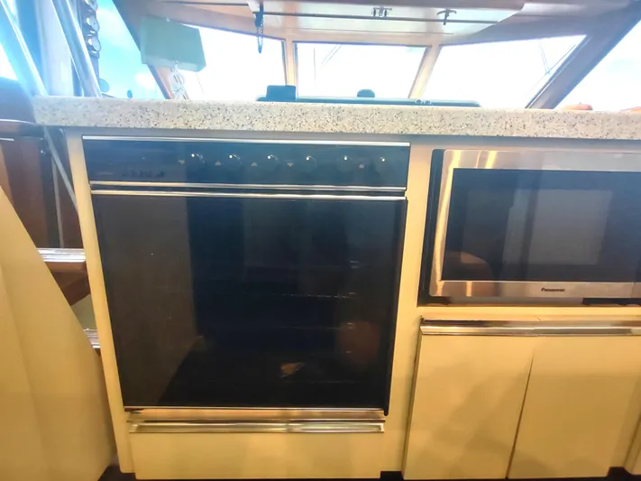  Yacht Photos Pics 1988 Hatteras 60 Motor Yacht kitchen with oven and microwave.