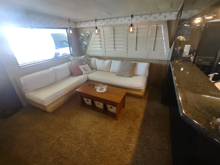 Yacht Photos Pics Interior of 1988 Hatteras 60 Motor Yacht with cozy seating and modern decor.
