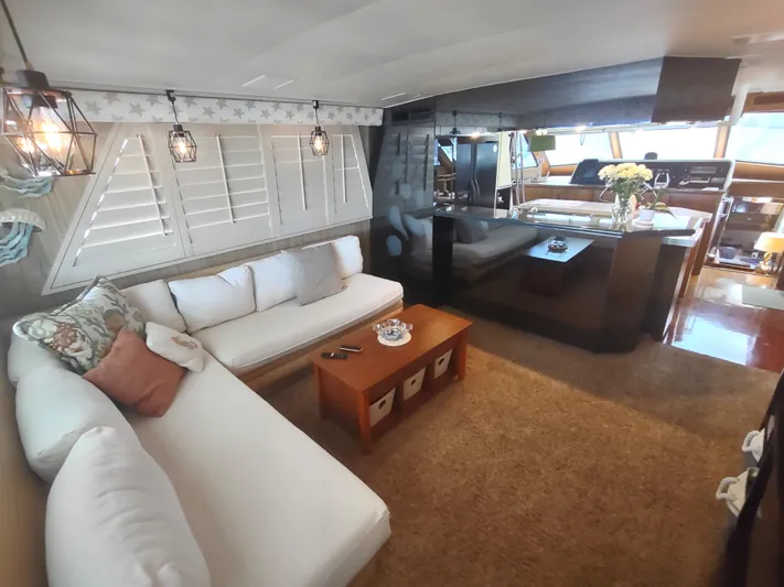  Yacht Photos Pics Interior of 1988 Hatteras 60 Motor Yacht with cozy seating and elegant decor.