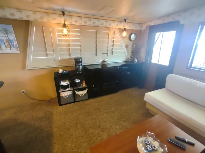  Yacht Photos Pics Interior of 1988 Hatteras 60 Motor Yacht with cozy seating and modern decor.