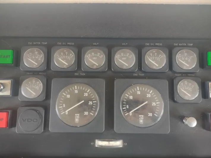  Yacht Photos Pics Control panel of a 1988 Hatteras 60 Motor Yacht with gauges and indicators.