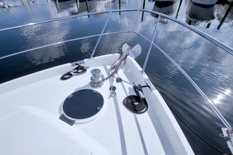 Bliss Yacht Photos Pics Bow of 2005 Neptunus 62 Flybridge yacht with anchor and winch.
