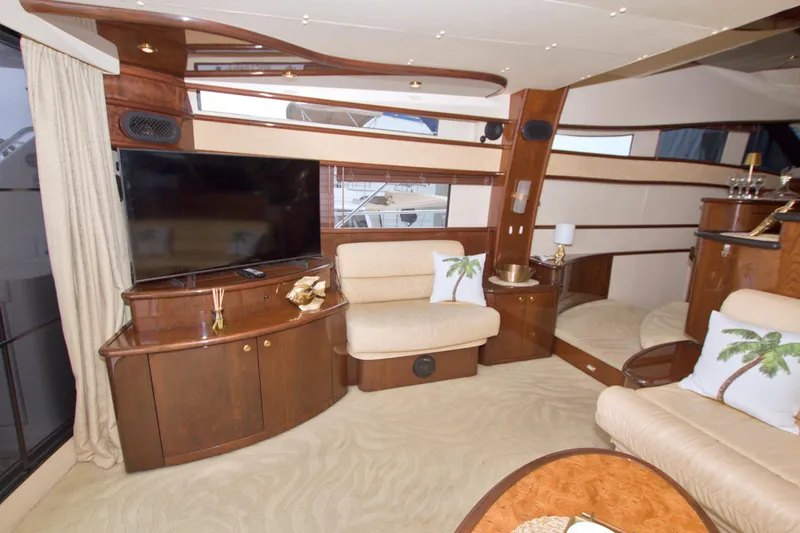 Bliss Yacht Photos Pics Luxurious interior of 2005 Neptunus 62 Flybridge yacht with elegant wood finishes.
